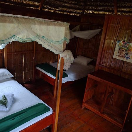 Green Forest Ecolodge Puerto Montufar Bagian luar foto