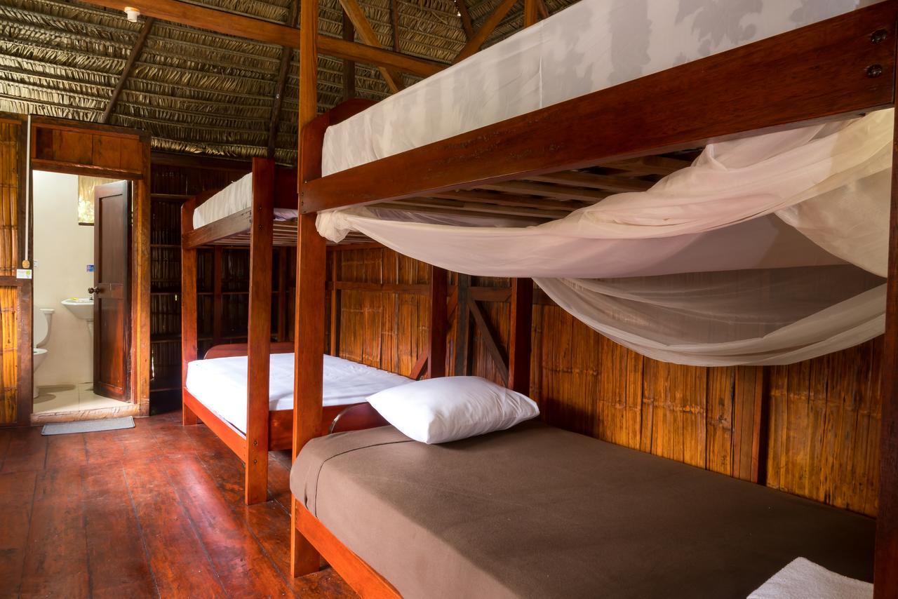 Green Forest Ecolodge Puerto Montufar Bagian luar foto
